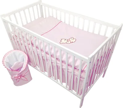 A baby crib with bedding and a sleeping bag.