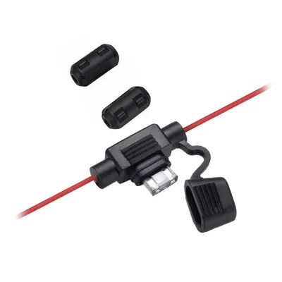 A close-up shot of a car antenna adapter with a red wire and a protective cap.