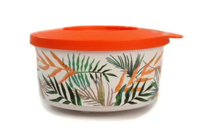 A round food container with a tropical leaf pattern and an orange lid, isolated on a white background.