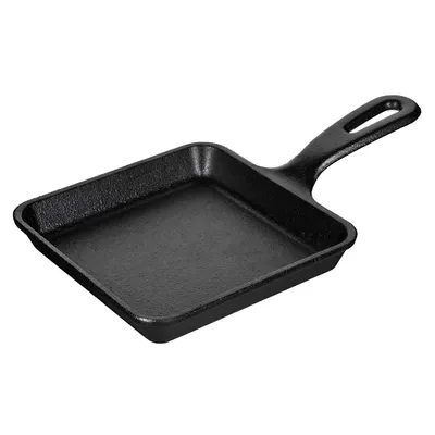 A black cast iron square pan with a handle, shown from a slightly elevated side angle against a white background.