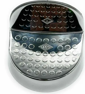 A close-up, top-down view of a chrome-plated footrest for a WESCO MINI MASTER bin.