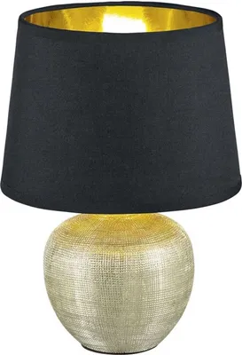 A table lamp with a black shade and a textured gold base.