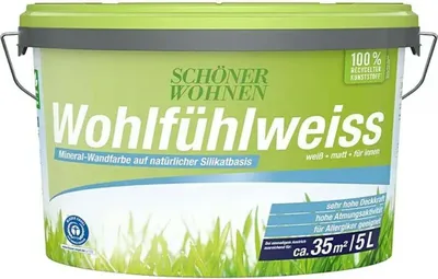 A bucket of white mineral wall paint with grass imagery on the label.