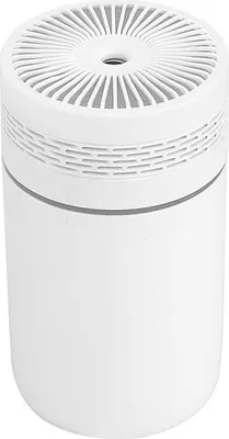 A white cylindrical humidifier with a slatted top.