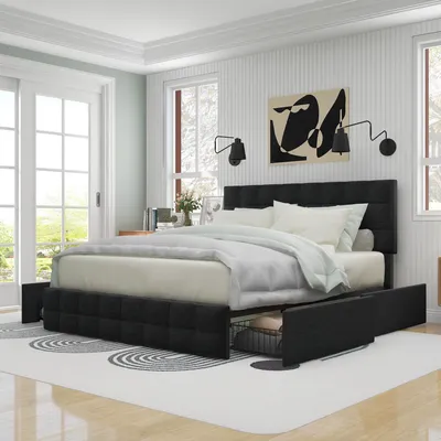 A bedroom scene featuring a black upholstered bed with storage drawers.