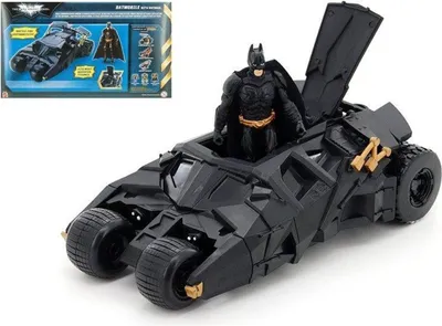 A toy Batmobile with a Batman figure inside, shown from a slightly elevated side angle against a white background. A smaller image of the product packaging is visible in the upper left corner.