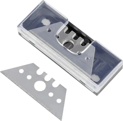 A set of trapezoidal utility blades in a clear plastic case, with one blade detached and placed in front of the case.