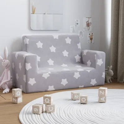 A child's sofa with a star pattern in a room with toys and decorations.