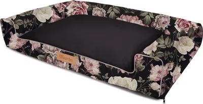 A dog bed with a floral pattern.