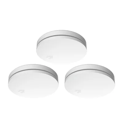 Three white smoke detectors are arranged in a triangular formation against a white background.