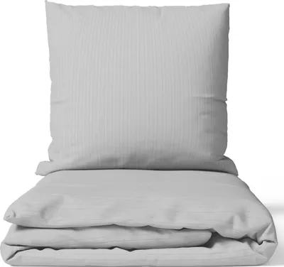 A folded duvet cover and a pillowcase, both with a subtle pinstripe pattern, are neatly arranged on a white background.