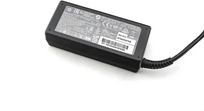A black HP AC adapter is shown on a white background.