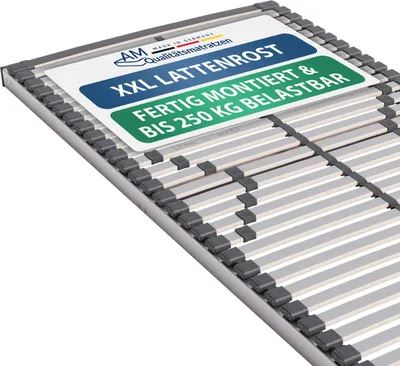 A close-up, angled view of a bed slat base with a label on top.