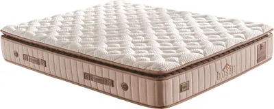 A close-up, angled view of a mattress with a plush, quilted top and a brown, textured side panel.