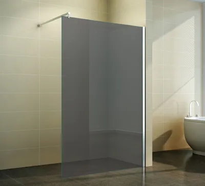 A modern bathroom with a walk-in shower enclosure and a bathtub.