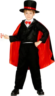A young boy dressed as a magician, holding playing cards.