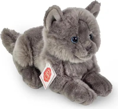 A plush toy cat lying down.