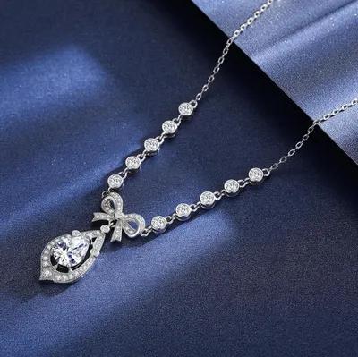 Image de Ensemble de bijoux pour femmes, comprenant un collier et des boucles d'oreilles ornés d'un nœud, longueur 40+5 cm, idéal pour un mariage