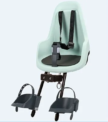 A child's bicycle seat with footrests and straps, isolated on a light gray background.