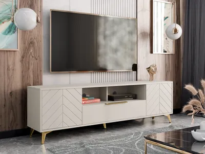 A modern living room with a TV stand and television.