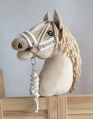 Immagine prodotto di Set per cavalli Hobby: cavezza A3 con pelliccia bianca + corda per legare - bianco e beige