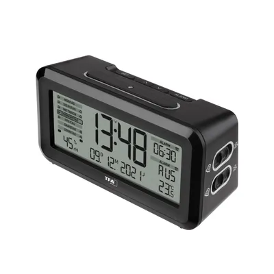 A digital alarm clock is shown against a white background.
