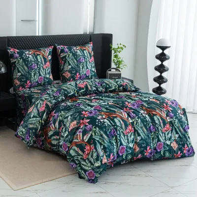 A bed with floral patterned bedding.