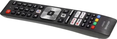 A black remote control with various buttons is shown against a white background.