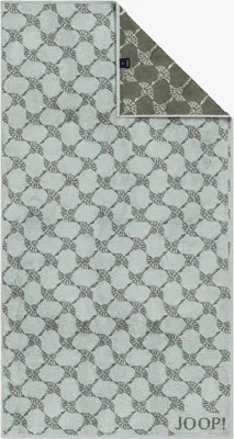 A towel is shown flat on a white background, with a corner folded to reveal the reverse side.