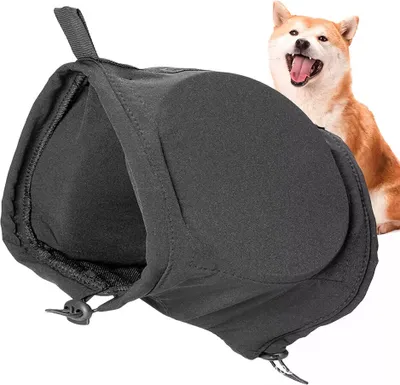 A dog is partially visible behind a dark gray dog ear protector.