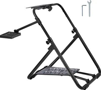 A black metal racing wheel stand is shown against a white background. The stand is angled, showing its structure and the mounting plates for a steering wheel and pedals. Tools are visible in the upper right corner.
