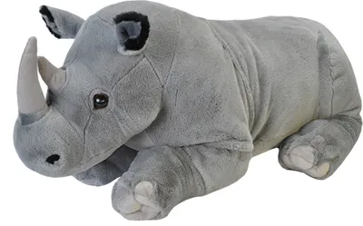 A plush toy rhinoceros lying down on a white background.