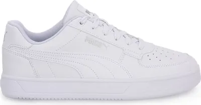 A side view of a white Puma Caven 2.0 Jr. sports shoe.