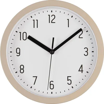 A close-up view of a round analog wall clock with a beige frame and white face.