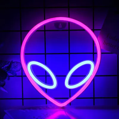 A neon alien head sign with pink and light blue lights.