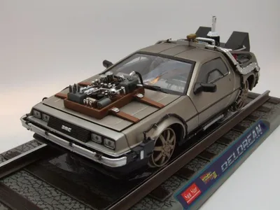 Produktbild von DeLorean Back to the Future Zurück in die Zukunft Teil 3 auf Bahnschiene Modellauto 1:18 Sun Star