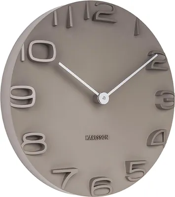 A close-up, angled view of a Karlsson wall clock.