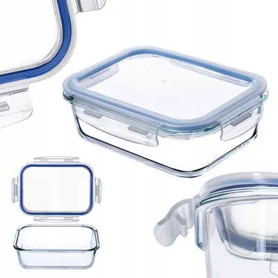 A collection of glass food storage containers with blue lids.