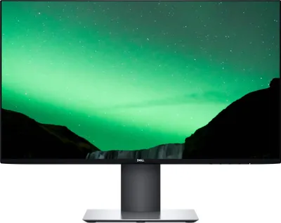 A Dell monitor displaying a nature scene.
