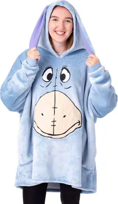 A woman wearing a blue Eeyore-themed blanket hoodie.