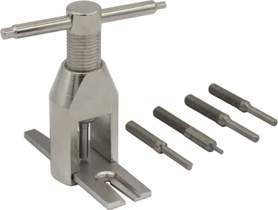 A metal tool set for removing gears from a motor, with four interchangeable tips.