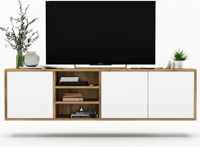 A modern TV stand with white doors and wood accents, featuring a large TV and decorative items.