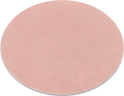A circular pink rug is shown from a slightly elevated angle against a white background.