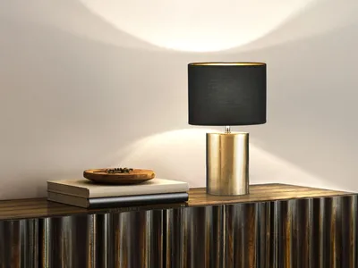 Immagine prodotto di Lampada da tavolo con base in Vetroceramica color bronzo e paralume in tessuto nero interno oro, altezza 43 cm
