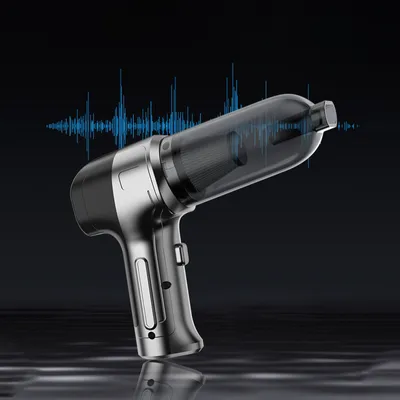 A silver and black handheld vacuum cleaner is shown against a dark background with a blue sound wave graphic overlay.