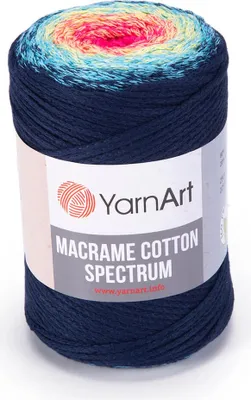 A spool of macrame cotton yarn with a gradient color pattern.