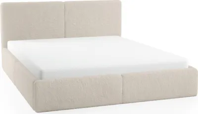 A beige upholstered bed with a white mattress.