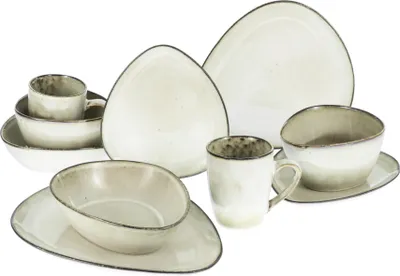 A collection of ceramic tableware, including plates, bowls, and mugs, arranged on a white background.