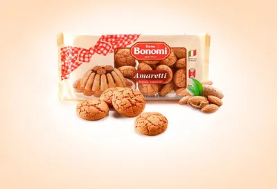 A package of Bonomi Amaretti cookies with some loose cookies and almonds scattered around.