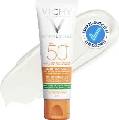 A tube of Vichy Capital Soleil Mattifying 3-In-1 SPF50+ sunscreen is shown against a white background with a smear of sunscreen.